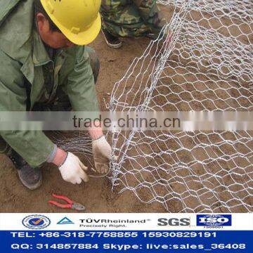 Slope protection system for protection engineering of seaside area river bank gabion cages