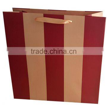 Paper gift shopping bag with embossed stripe design