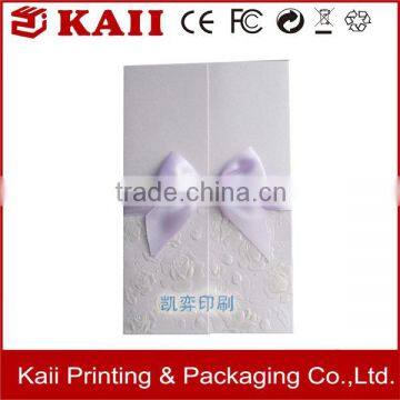 a white greeting card with ribbon,greeting card printing,greeting card making machine