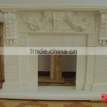 white artificial stone fireplace mantel