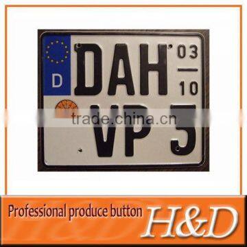 Printed and embossed number serial plates