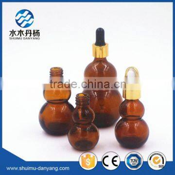 Hot sale amber glass calabush shaped essential oil bottle