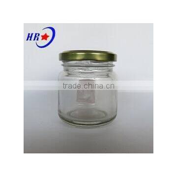 round glass jar with golden lid