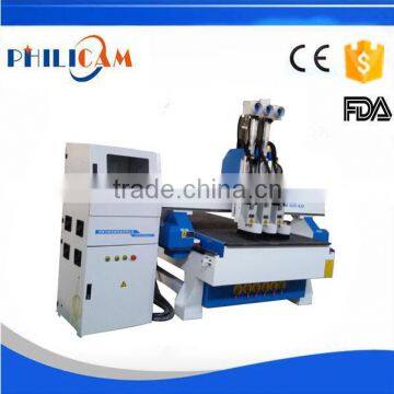 FLDM1325 cnc router machine cutting wood with 3 heads