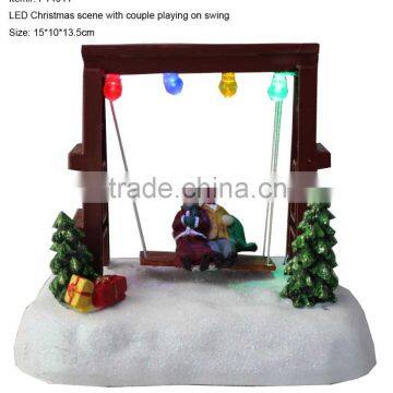 Christmas decoration LED Christmas scene with couple playing on swing