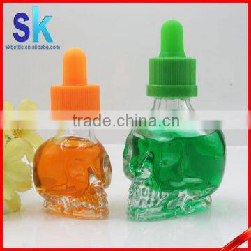30ml clear skull shaped glass liquid bottle with child proof dropper