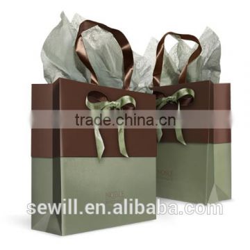 Noble luxury paper shopping bag for boutique with bowknot