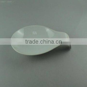 white porcelain dish with spoon shape