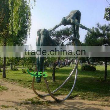 Bronze park statue of sportswomen