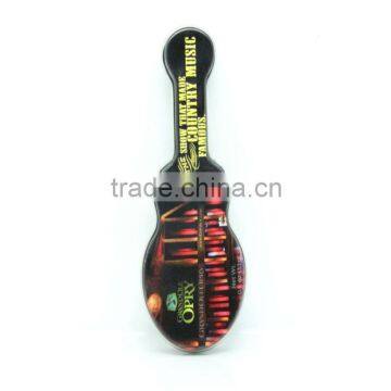 Black guitar-shaped candy tin box