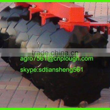 Notched disc harrow blade for agricultural harrow