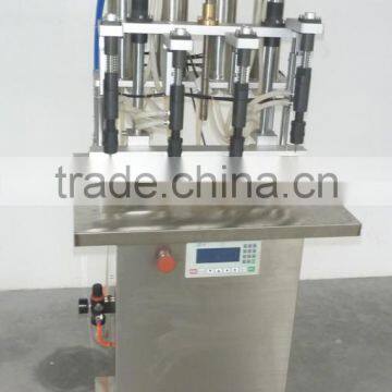 China Guangzhou factory small perfume bottle four head filling machine/equipment with negative pressure for sale