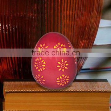 Ceramic red egg shape luminary with inner led candle for bedroom, indoor decoration