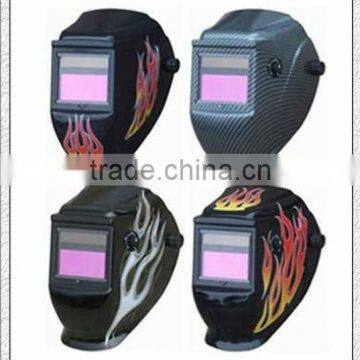 Auto-darkening welding helmet