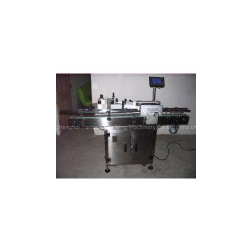 Wrap around labeling machine