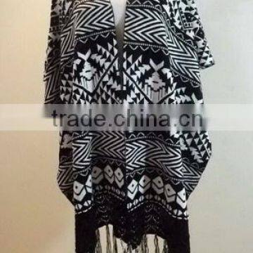 Ladies geometrical pattern poncho knitted cardigan, sweater with fringe