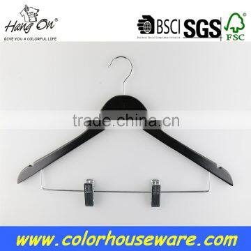Black wooden hanger with clips