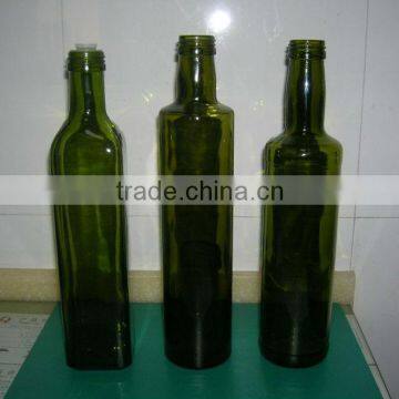 Round green glass olive oil bottle