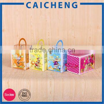 Children handmade small cube shaped paper snack box