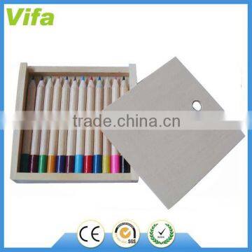 kids colour pencils in wooden box