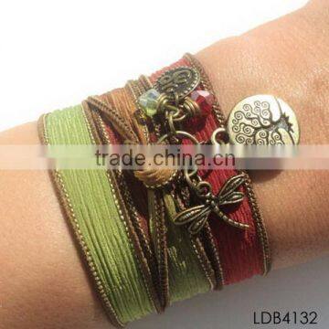 Fashion ribbon bracelet with gold plated dragonfly and tree china supplier                        
                                                Quality Choice