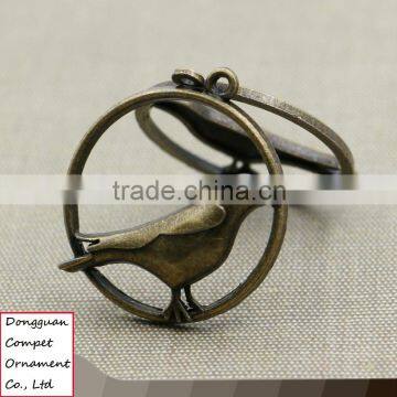 Wholesale Metal Plating Zinc Alloy Hollow Out Cuckoo Bird Pendant photo-2