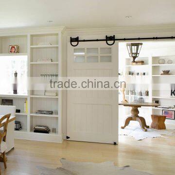 Traditional sliding barn door with U shaped horseshoe hardware for diningroom