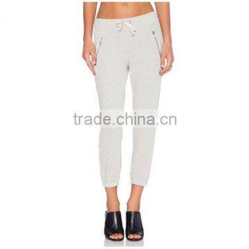 Wholesale Ladies white skinny sweat pants with side zipper pockets