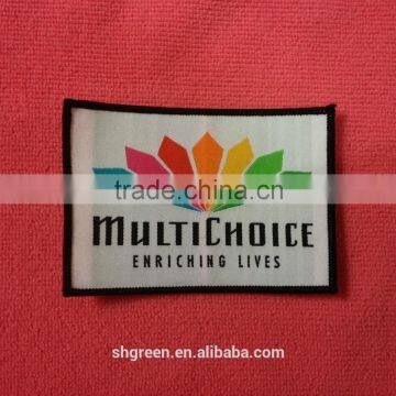colorful textile woven badge with merrow border