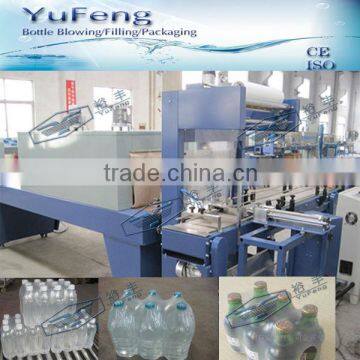 Automatic shrink wrapping machine