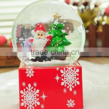 Supply resin Santa Claus music box snow globe