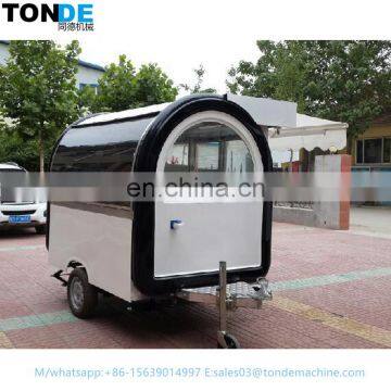 A mobile food trailer capable of producing hot dogs and barbecues.