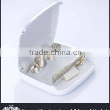 Silver metal cufflink and tie pin