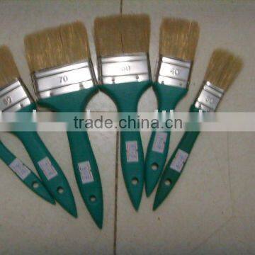 green plastic handle paint brush