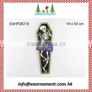 Halloween paper wall hanging of skull in coffin