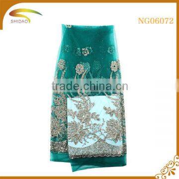 custom new arrival green metallic beaded stretch polyester sequined lace fabric for wedding dress garment