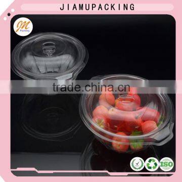 Clear plastic food and salad bowl or container with lid