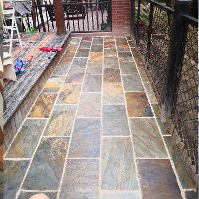 Natural Slate Courtyard Floor Tiles for Paving the Ground. Rusty and Warm-toned Garden Terrace Outdoor Homestay Floor Paved With Cultural Stones.