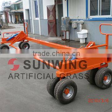 Artificial grass paving machine