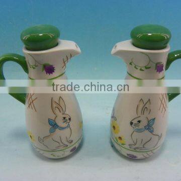 painting easter rabbit ceramic oil and vinegar bottle