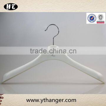 white plastic hanger with footgrip for clothes