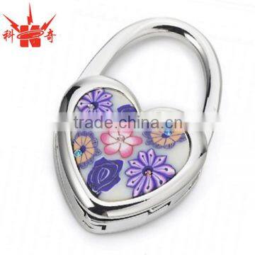 Hot sales Metal heart shape bag hanger with printing logo