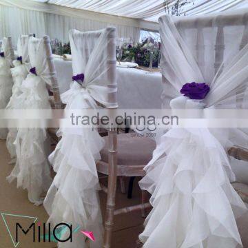 White ruffled chiavari chair covers