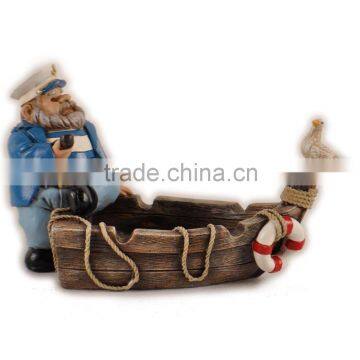 Resin products fat captain sitting on the boat with bird