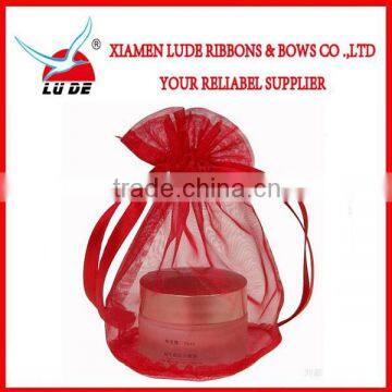 Red ribbon drawstring organza gift bag