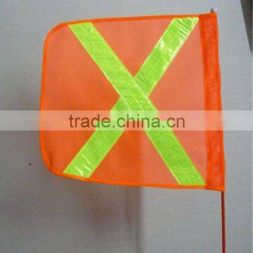 X orange safety warning flag