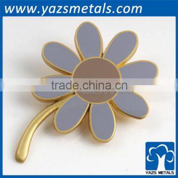 custom metal flower brooch