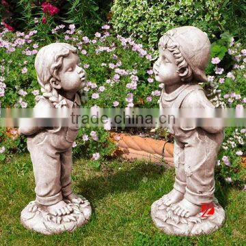 resin boy and girl garden sculpture