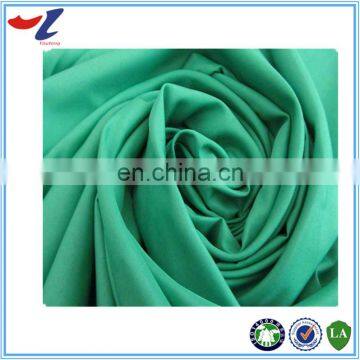 china supplier stocklot fabric garment lining 100% polyester taffeta fabric