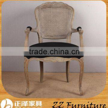 Rattan back dining chair with arm